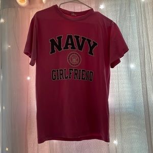 Pink T-Shirt Says navy girlfriend. It’s a size small but it’s kind of medium too